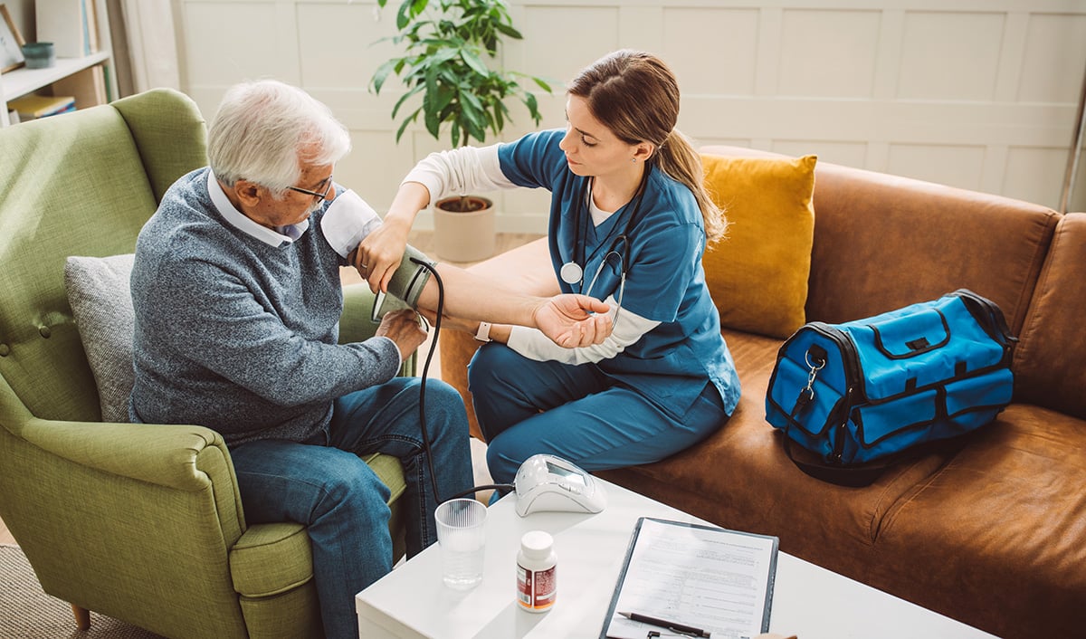 Home nurse checking a patient’s vitals
